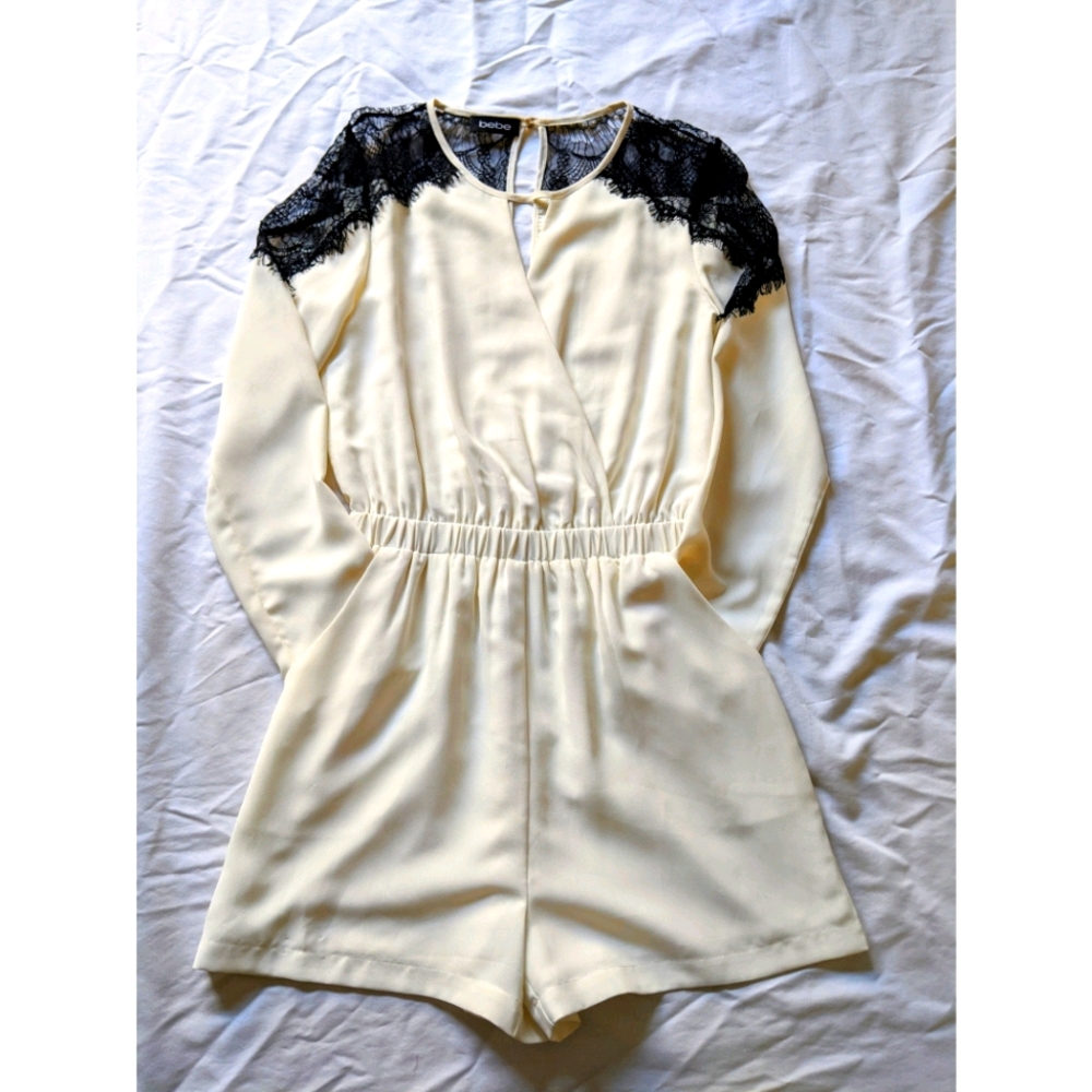 NWOT Bebe Long Sleeve Romper with Lace